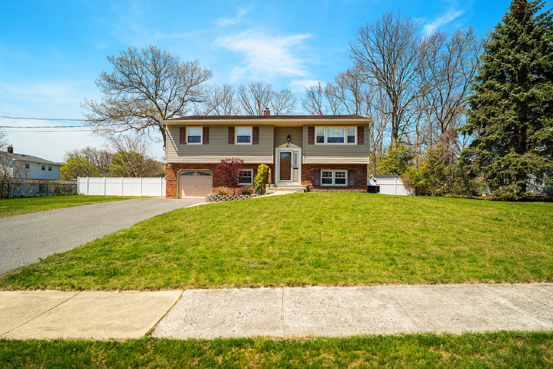 Front view of 4-bedroom bi-level home in the Candlewood section of Howell Township, New Jersey.